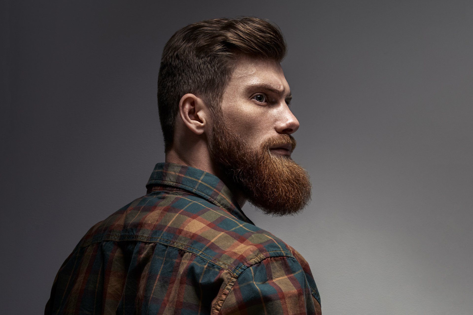 Side view portrait of thinking stylish young man looking away