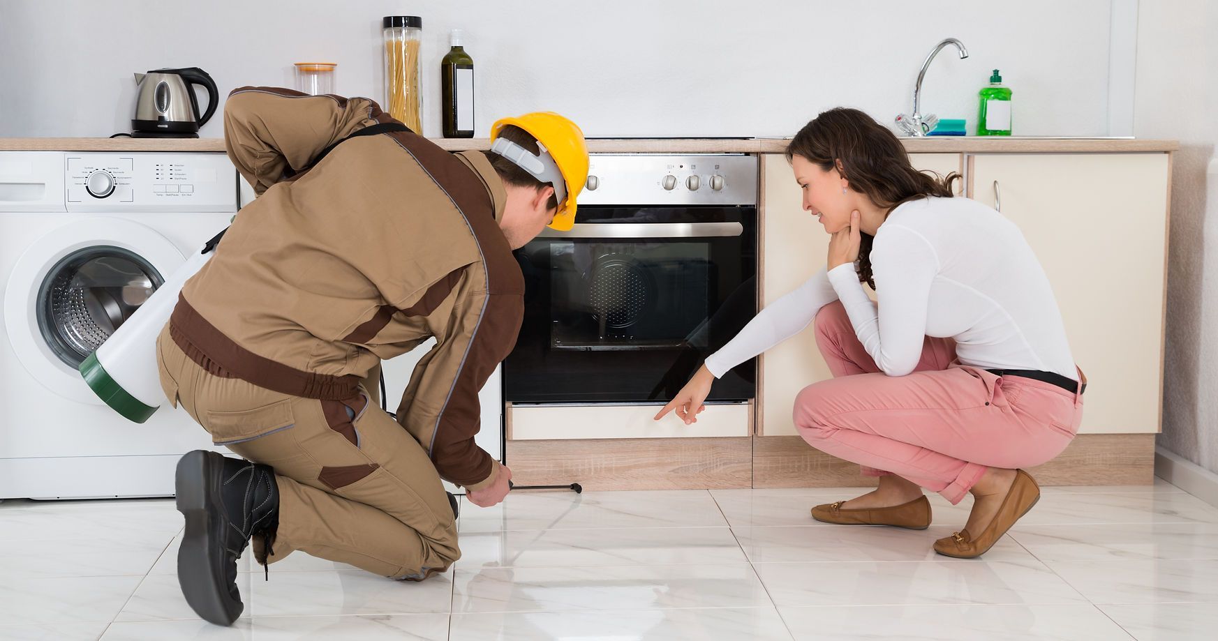 Worker inspecting kitchen floor
