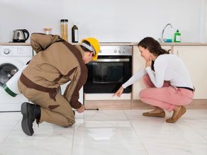 Worker inspecting kitchen floor