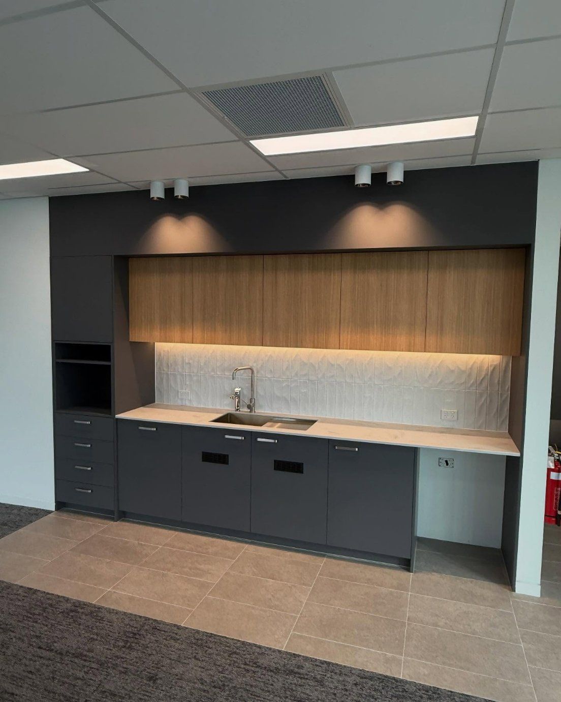 Modern Office Kitchen With Dark Gray Cabinets — Zeal Interiors in South Grafton, NSW