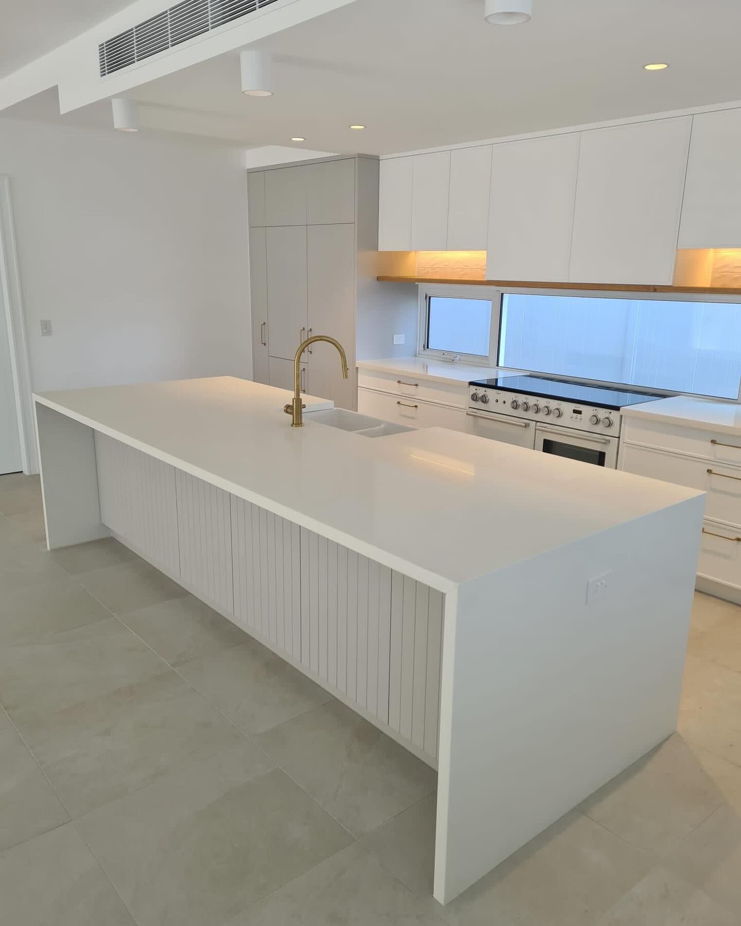 Modern White Kitchen with A Large Island — Zeal Interiors in Newcastle, NSW