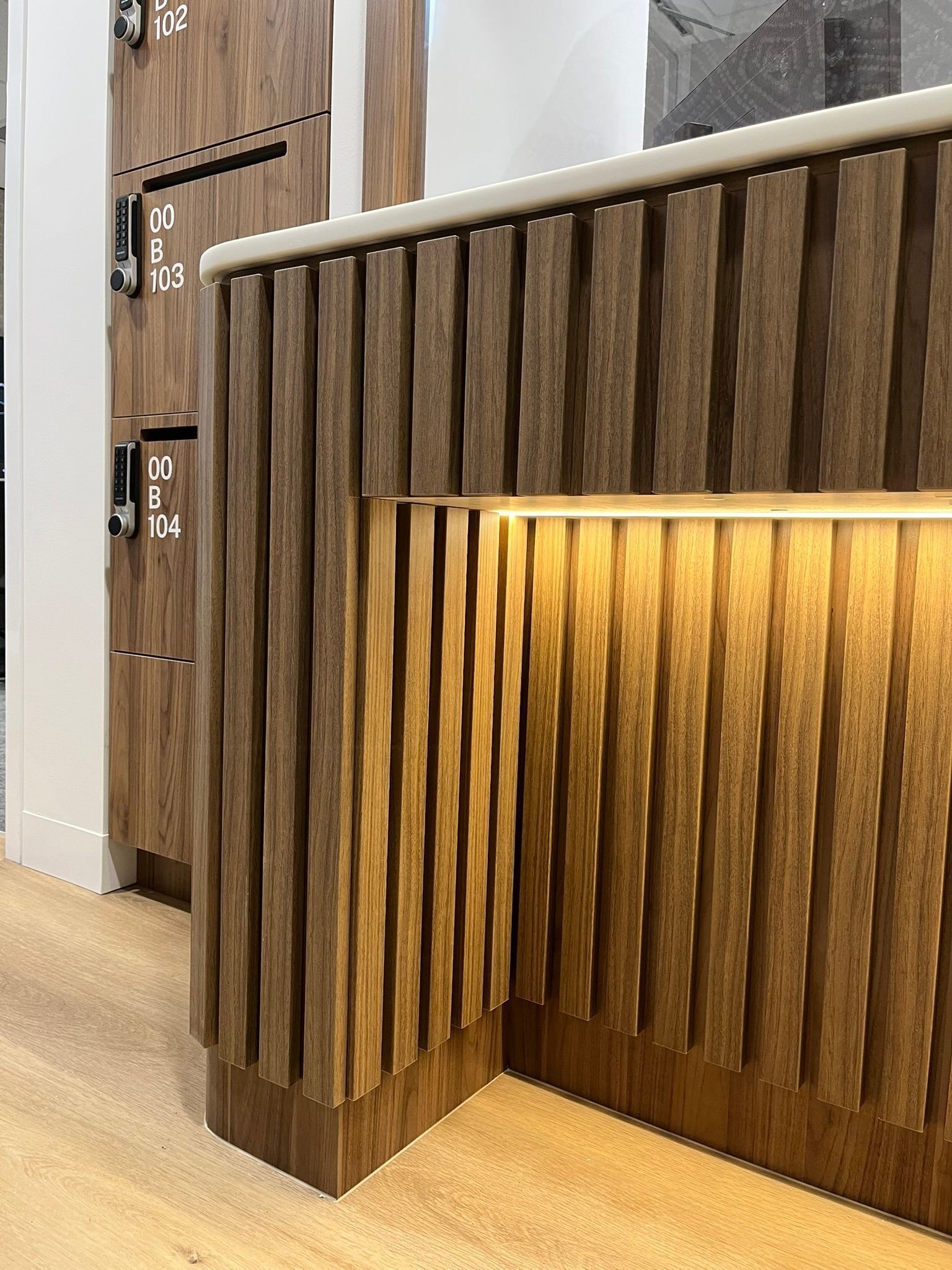 Wooden Slatted Reception Desk with Warm Underlighting in A Modern Interior —  Zeal Interiors & Joinery in South Grafton, NSW