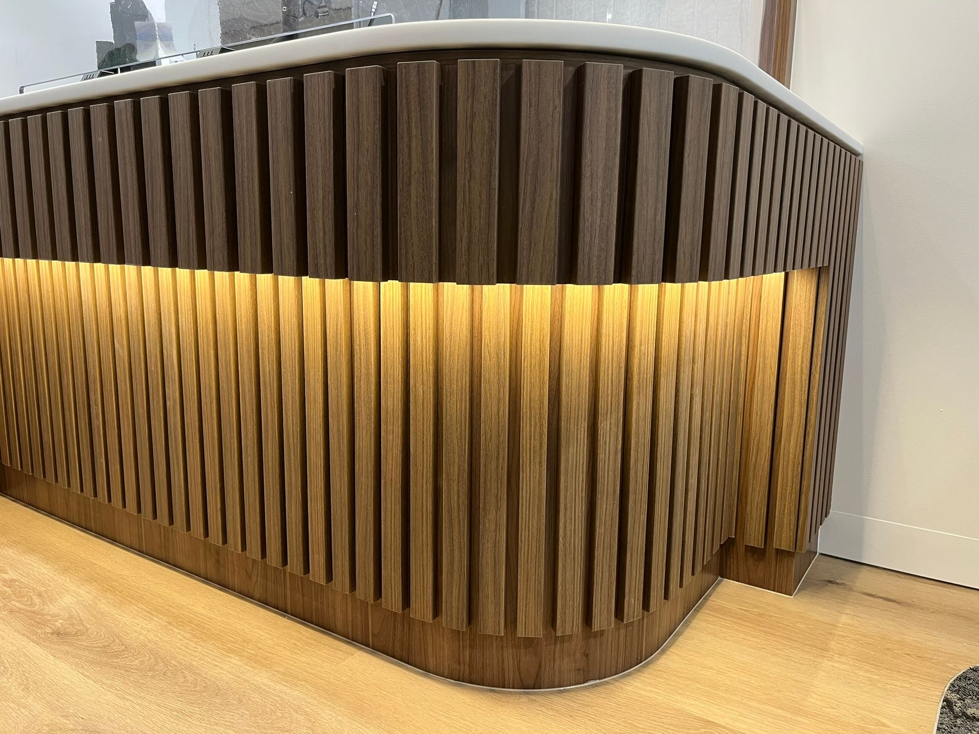 Curved Wooden Reception Desk with Vertical Slats —  Zeal Interiors & Joinery in South Grafton, NSW