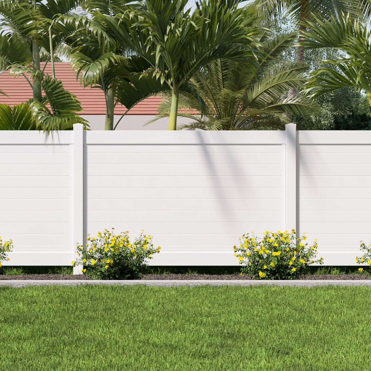 White fence with horizontal slats, lush green grass, yellow flowers, and palm trees in the background.