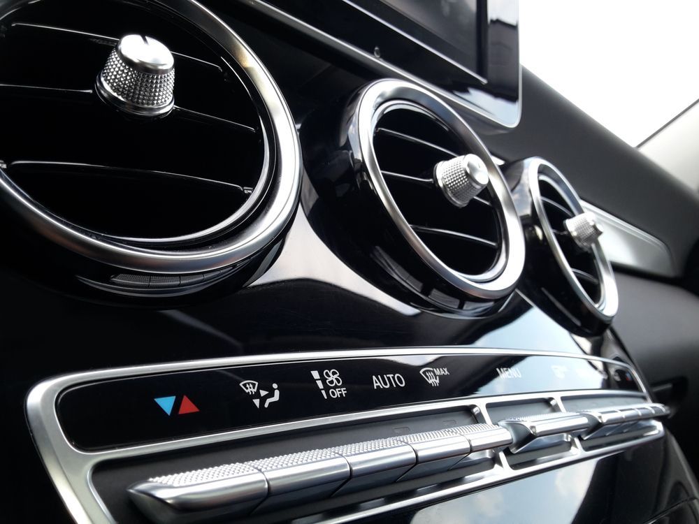 Close-up of a Car Dashboard With Chrome Air Vents and Climate Controls — AA Automotive Repairs in Forster, NSW