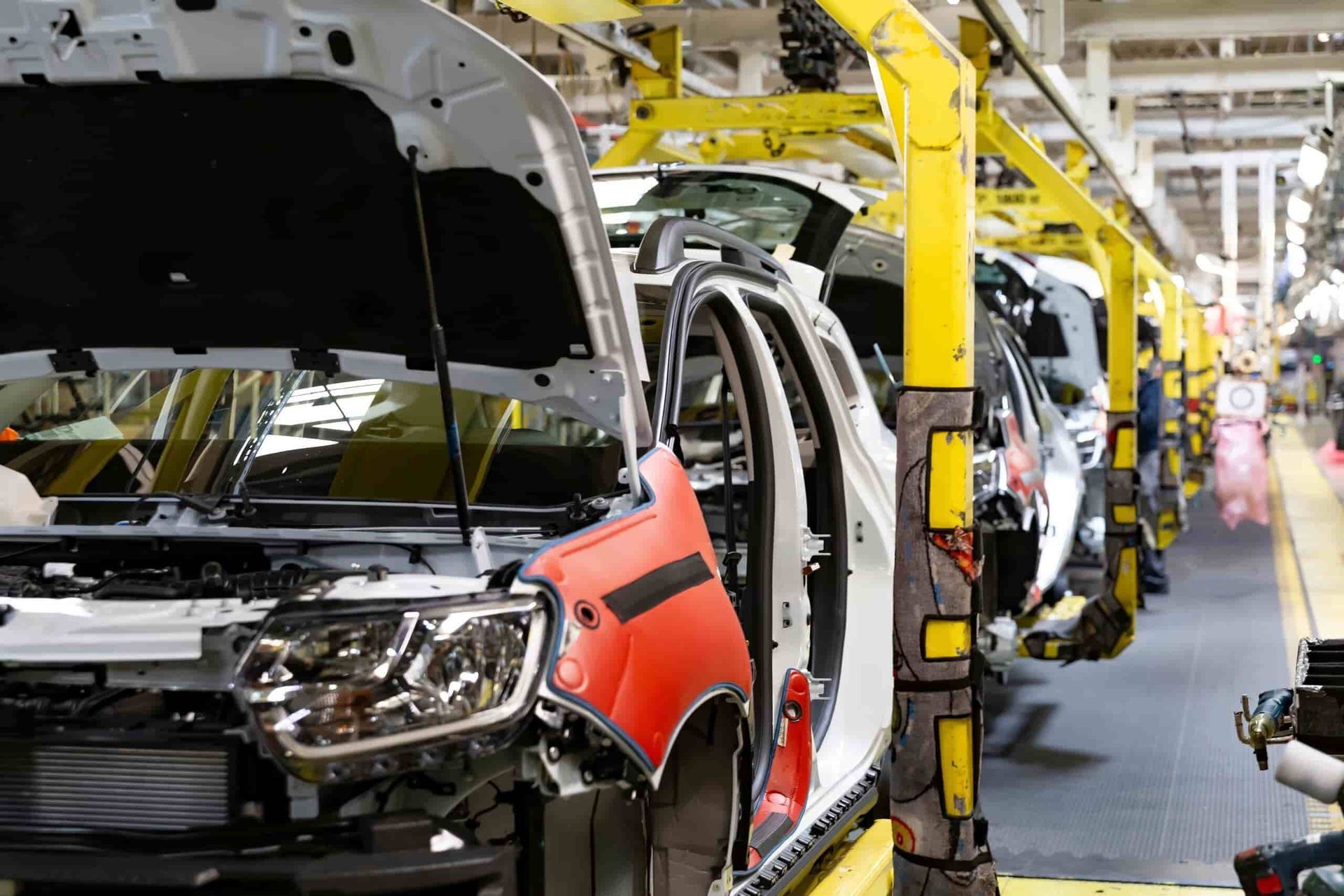 A Car is Being Built in a Factory With the Hood Open — AA Automotive Repairs in Forster, NSW