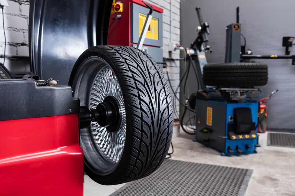 A Tyre is Being Balanced on a Machine in a Garage — AA Automotive Repairs in Forster, NSW