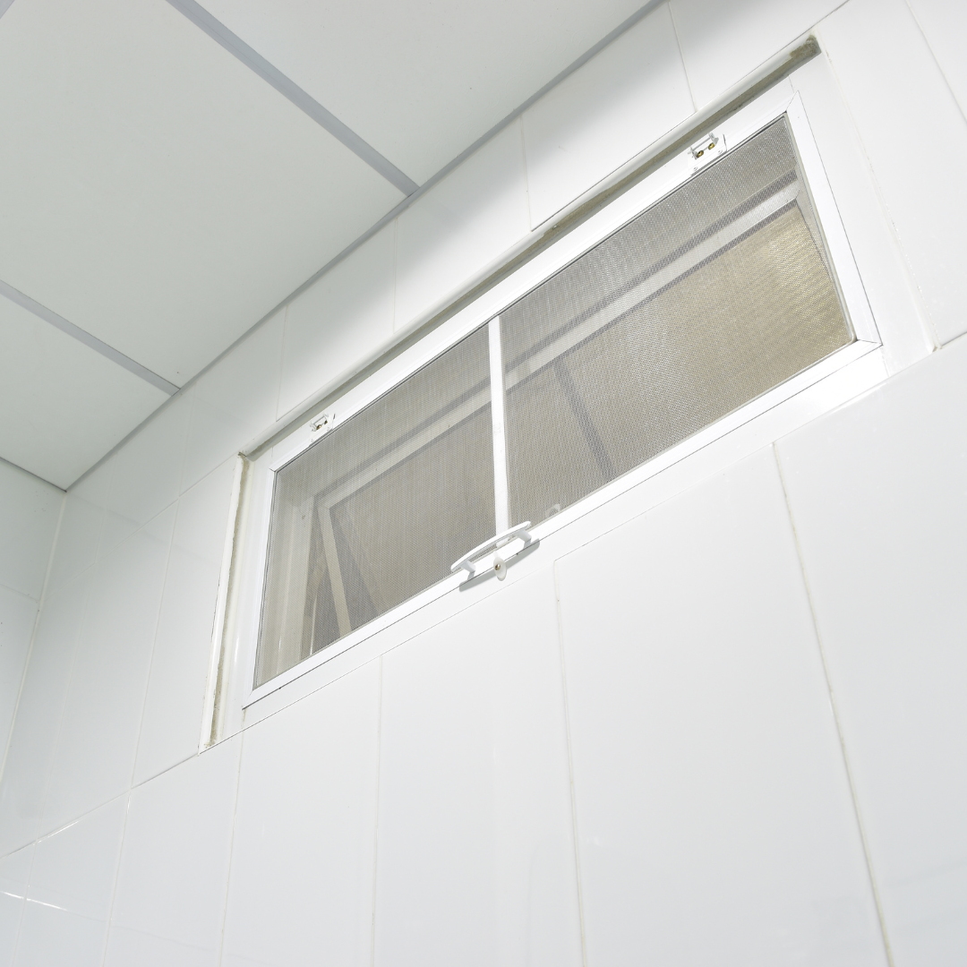 A white wall with a window in it