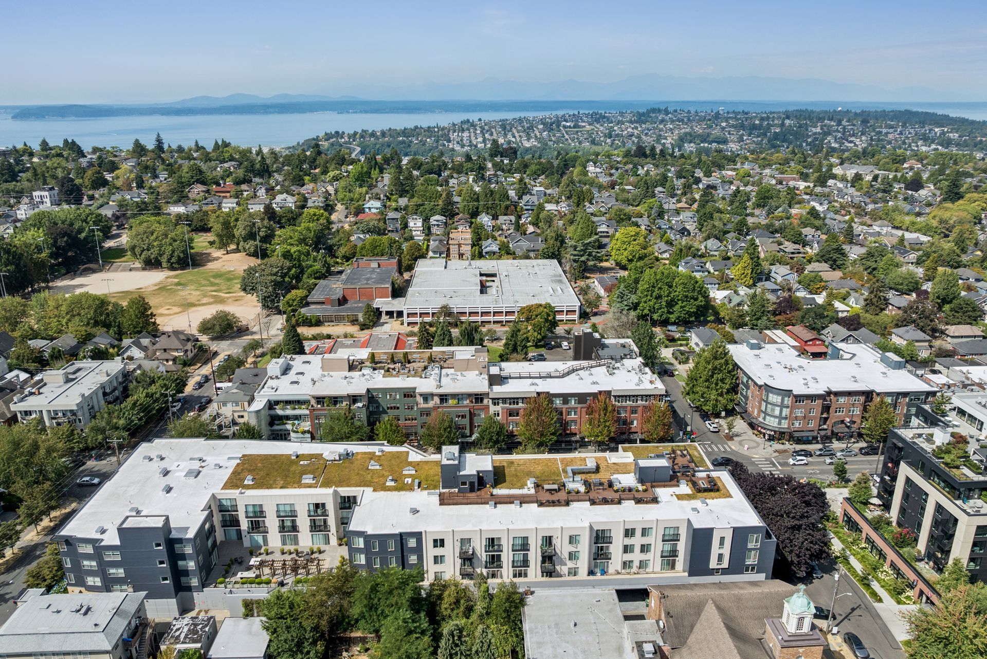 Overhead view of apartment communities and surrounding city area