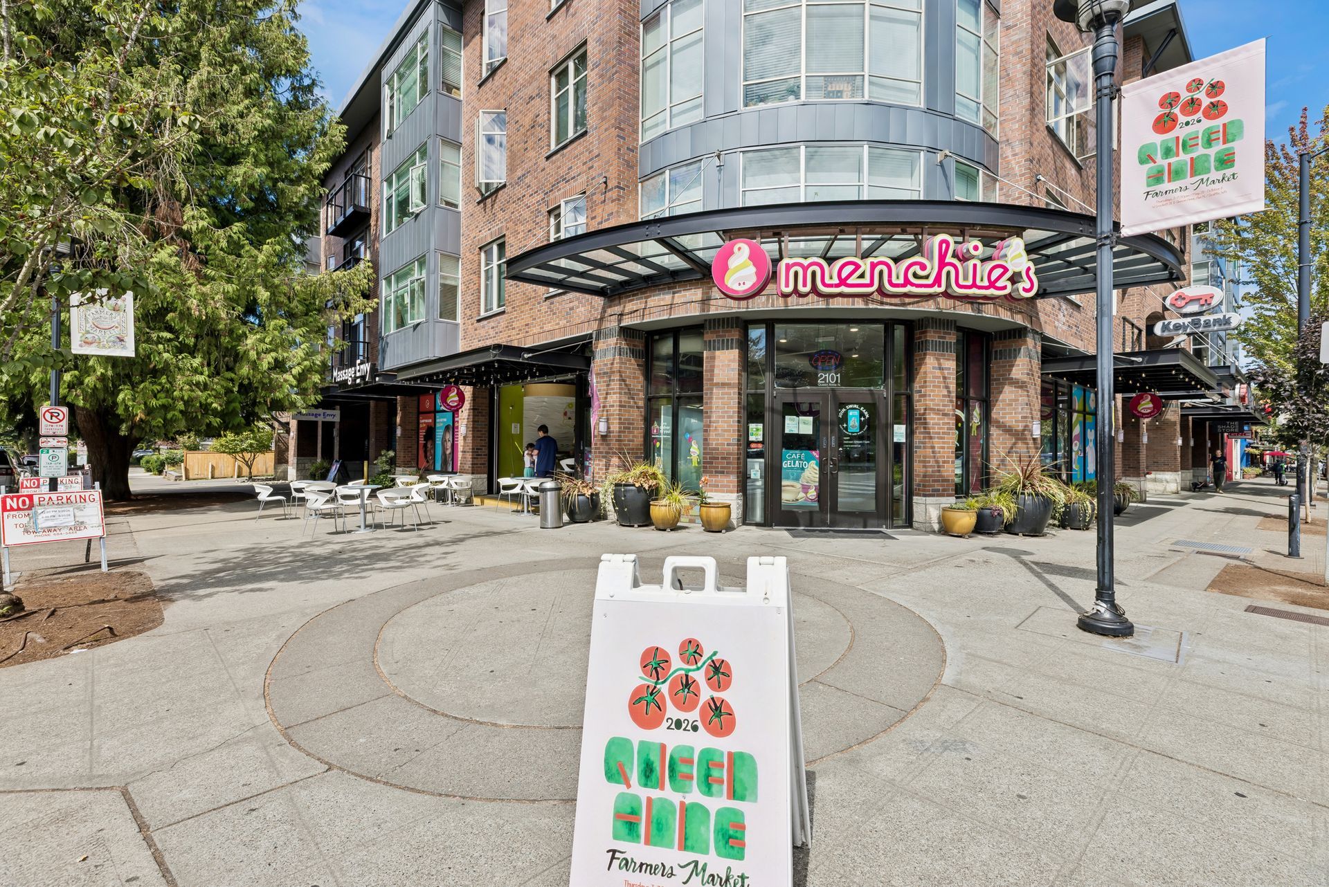 Exterior of Menchie's frozen yogurt and city block near Queen Anne Collection
