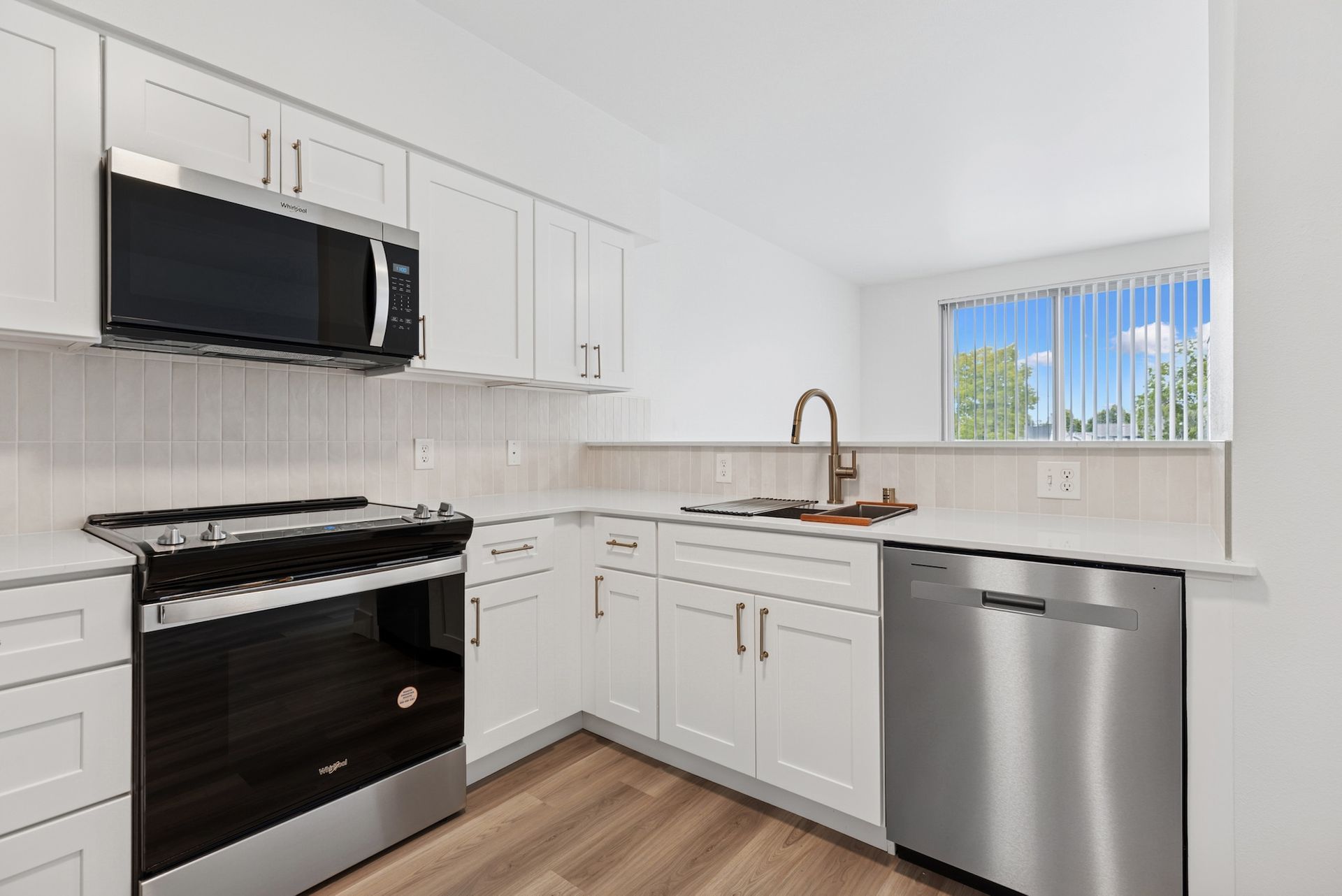 kitchen with stainless steel appliances and window