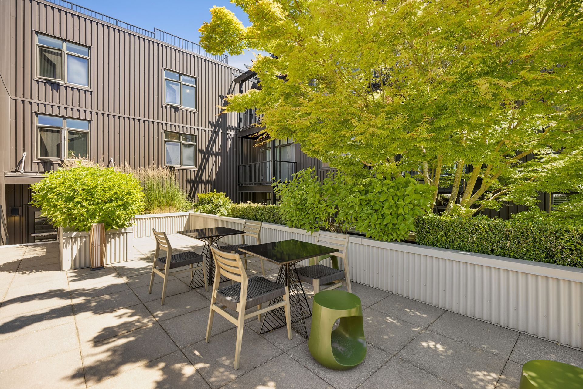eden hill apartments outdoor seating area with trees