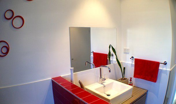Bathroom With Red Accents — Craig Allman Construction Pty Ltd In Fernhill, NSW
