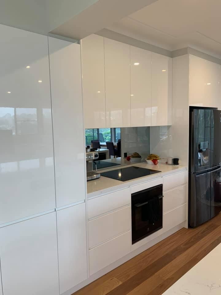 A Kitchen With White Cabinets — Craig Allman Construction Pty Ltd In Fernhill, NSW