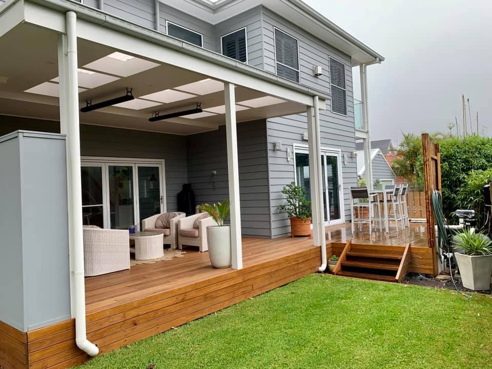 A Large House With a Wooden Deck and a Covered Porch — Craig Allman Construction Pty Ltd In Fernhill, NSW