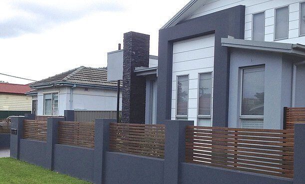 House with Concrete Fence — Craig Allman Construction Pty Ltd In Fernhill, NSW