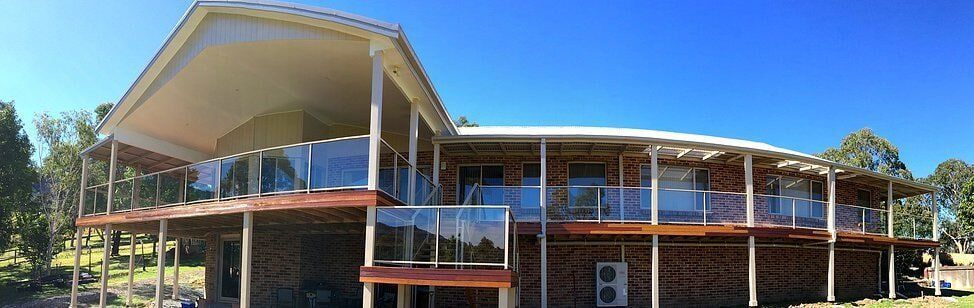 House with Glass Balcony — Craig Allman Construction Pty Ltd In Fernhill, NSW