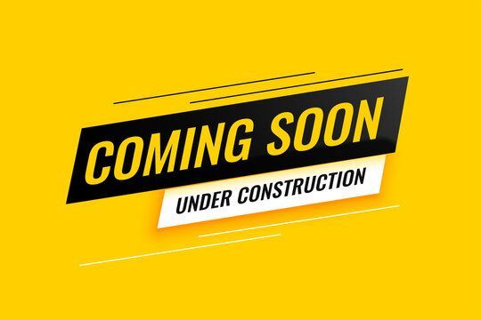 Yellow “Coming Soon” sign with “Under Construction” text on a bright background