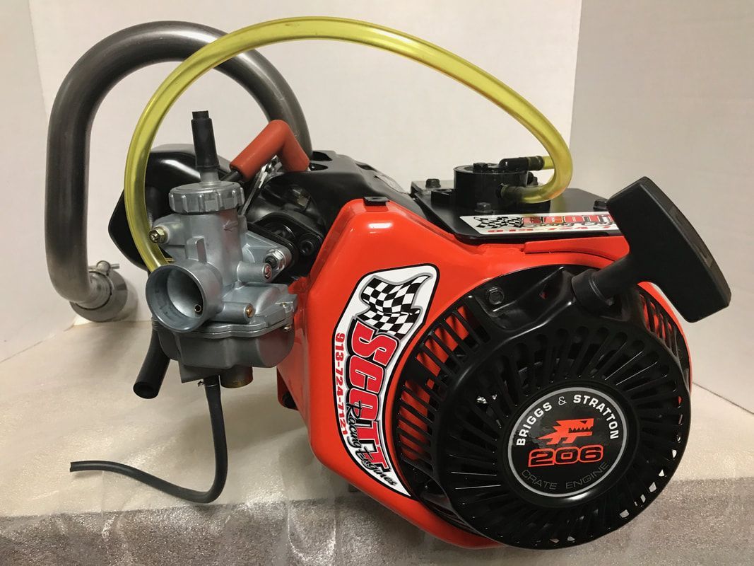 A red engine with a yellow hose attached to it