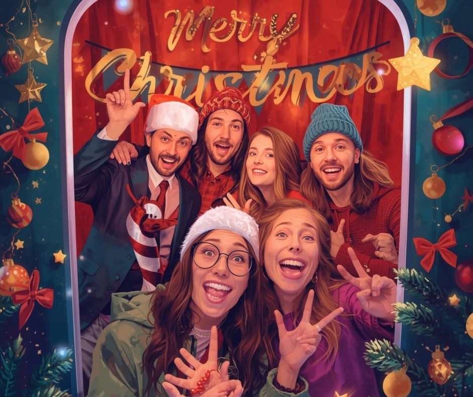 Festive group selfie with Santa hats, Christmas decorations, and a “Merry Christmas” sign.