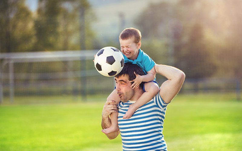 Father and Son Playing Soccer — Jacksonville, FL — Willman Air Father and Son Playing Soccer — Jacksonville, FL — Willman Air