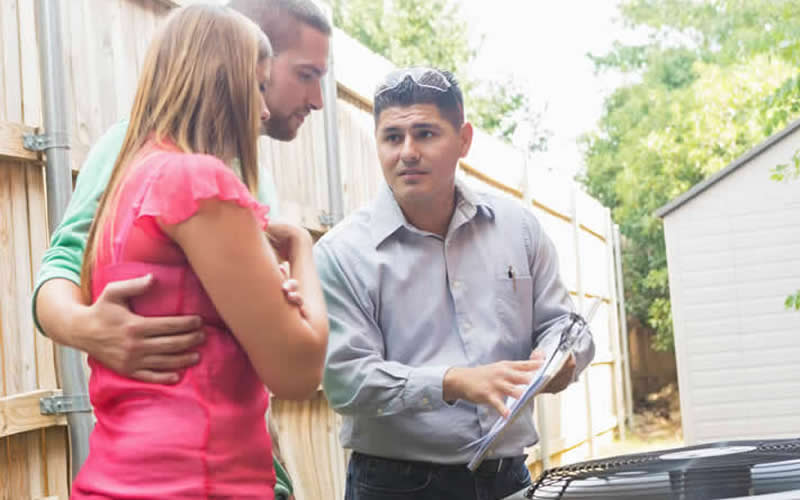 Technician Discussing HVAC Maintenance — Jacksonville, FL — Willman Air Technician Discussing HVAC Maintenance — Jacksonville, FL — Willman Air
