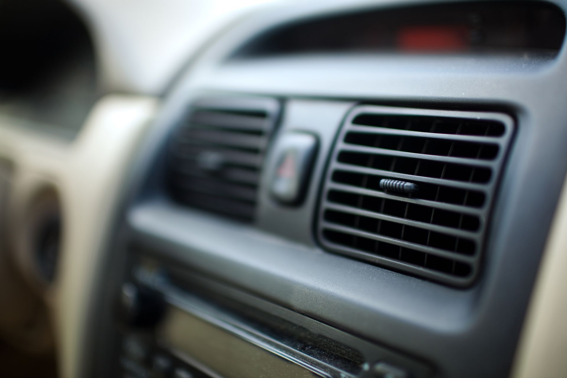 A close up of an air vent in a car