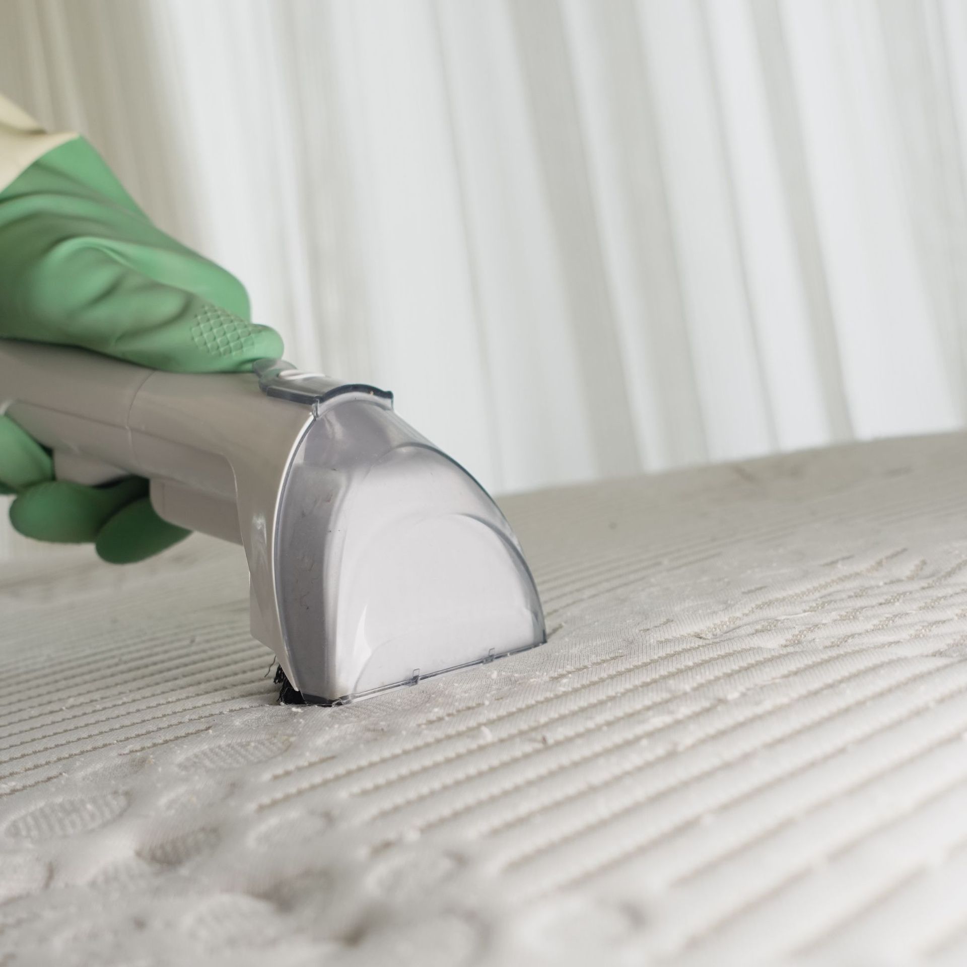 Arizona Carpet and Tile Steamers, Inc.- A black and white photo of a vacuum cleaner cleaning a carpet.