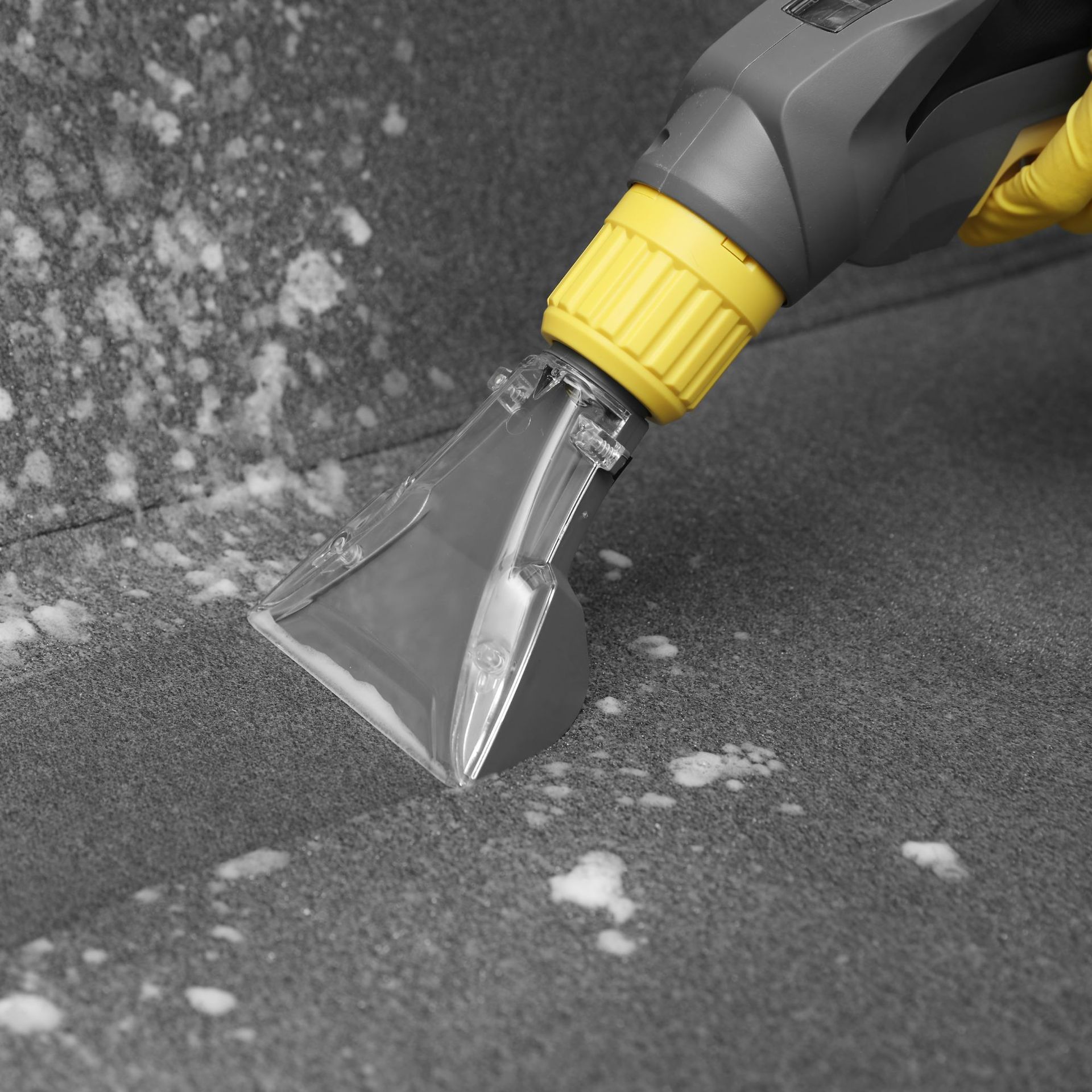 Arizona Carpet and Tile Steamers, Inc.- A black and white photo of a vacuum cleaner cleaning a carpet.