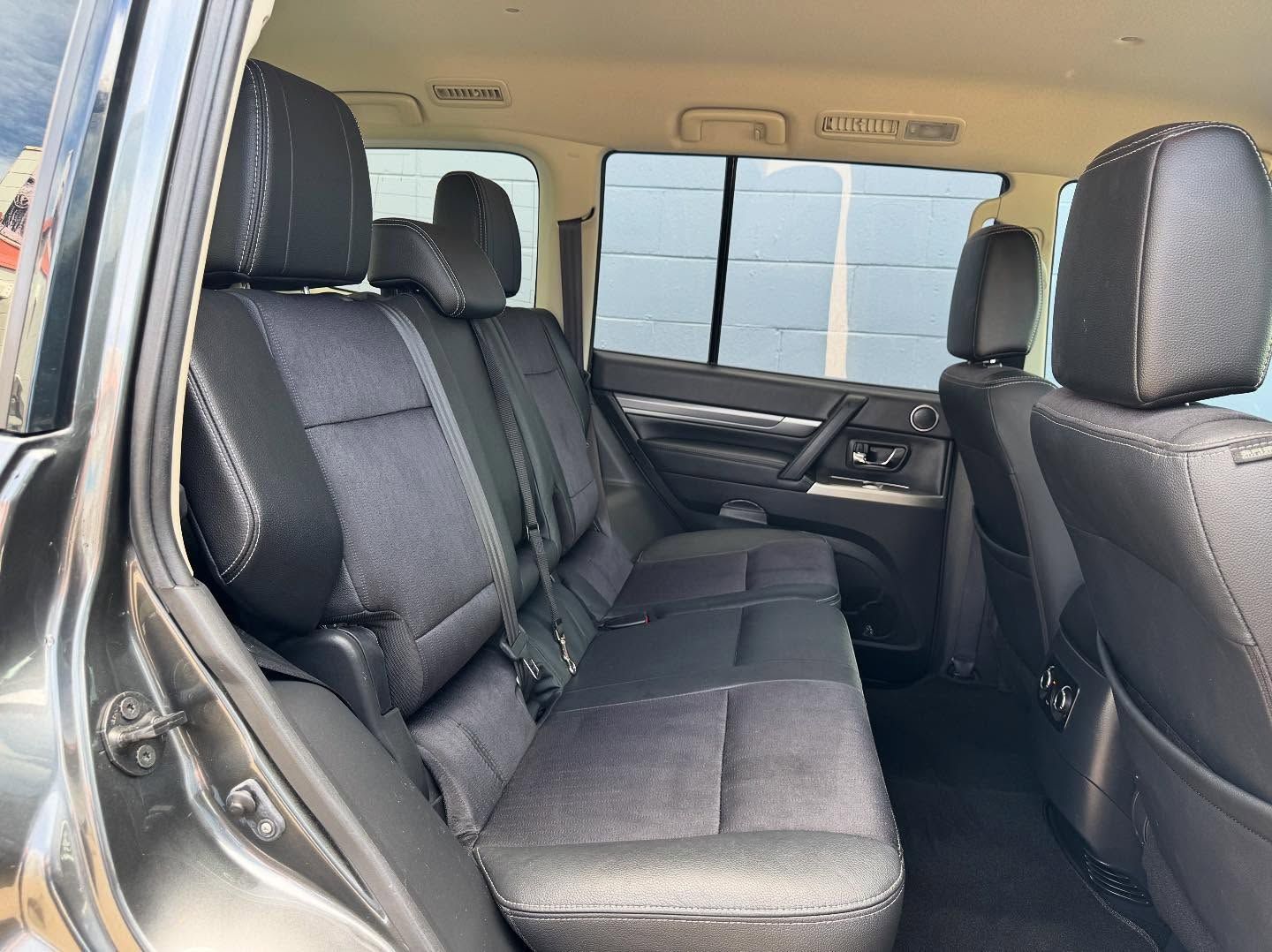 Rear View of a Black Suv Interior With Three Seats, Light Coming Through Windows — Oliver's Hand Car Wash in Norville, QLD