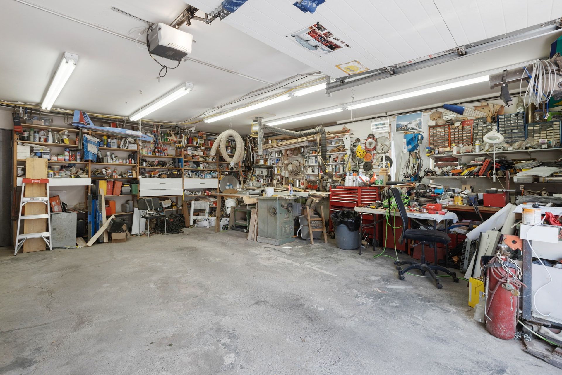 A large garage filled with lots of tools and equipment.