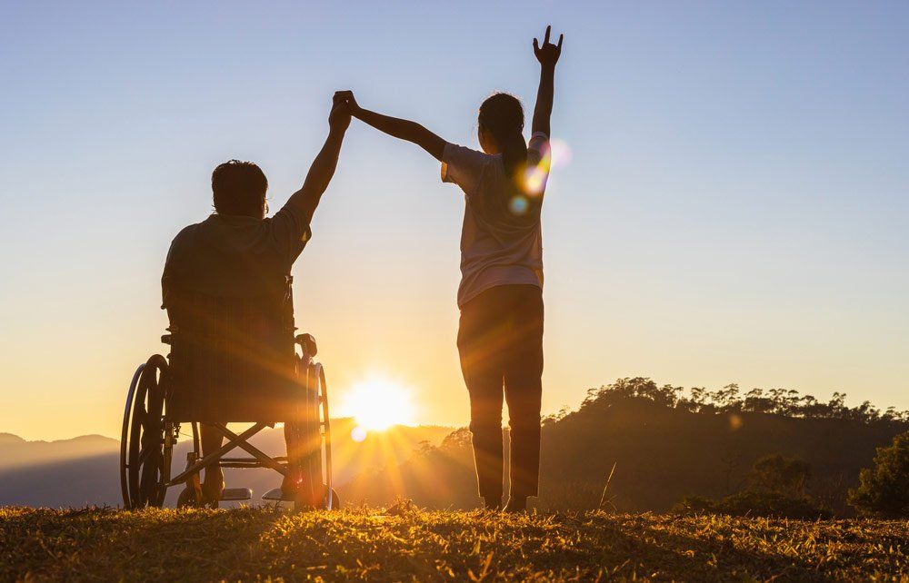 Disabled Man With His Care Helper Raising Hands — Better Access Support Services In Toowoomba, QLD