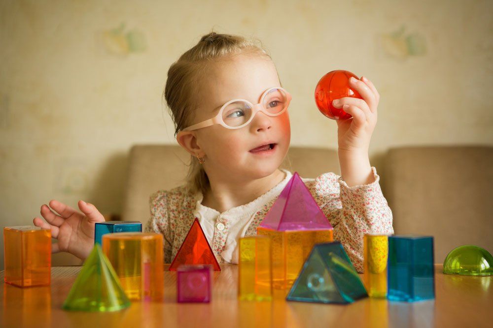 Girl Playing With Building Blocks — Better Access Support Services In Wyreema, QLD