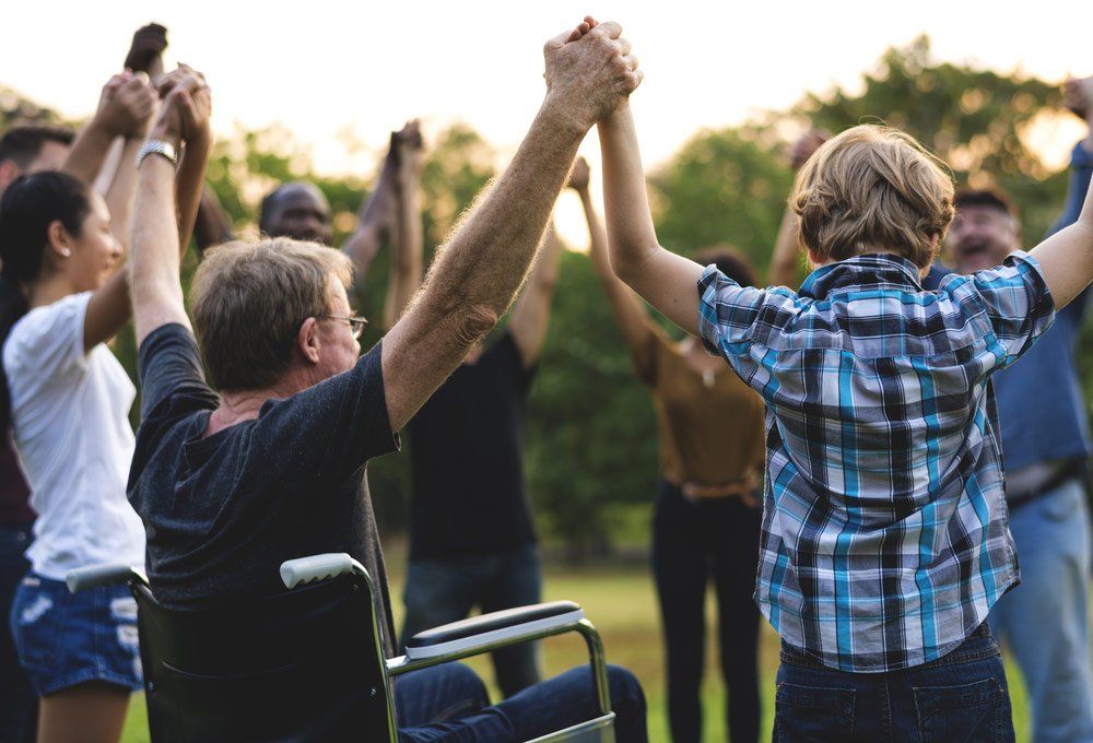Group Of People Holding Hands — Better Access Support Services In Wyreema, QLD