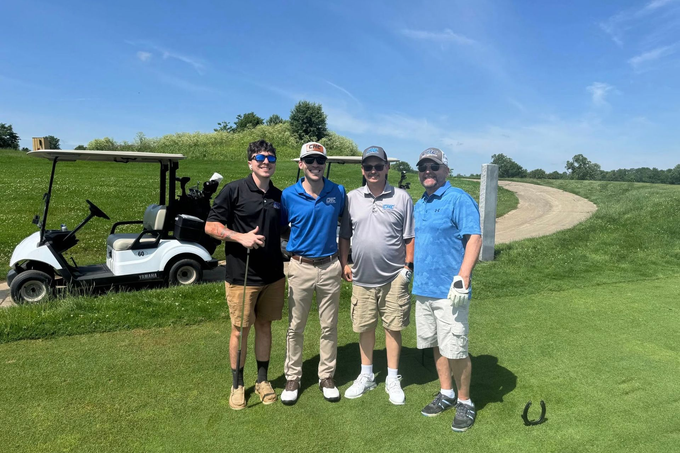 CHC team members together on a golf course