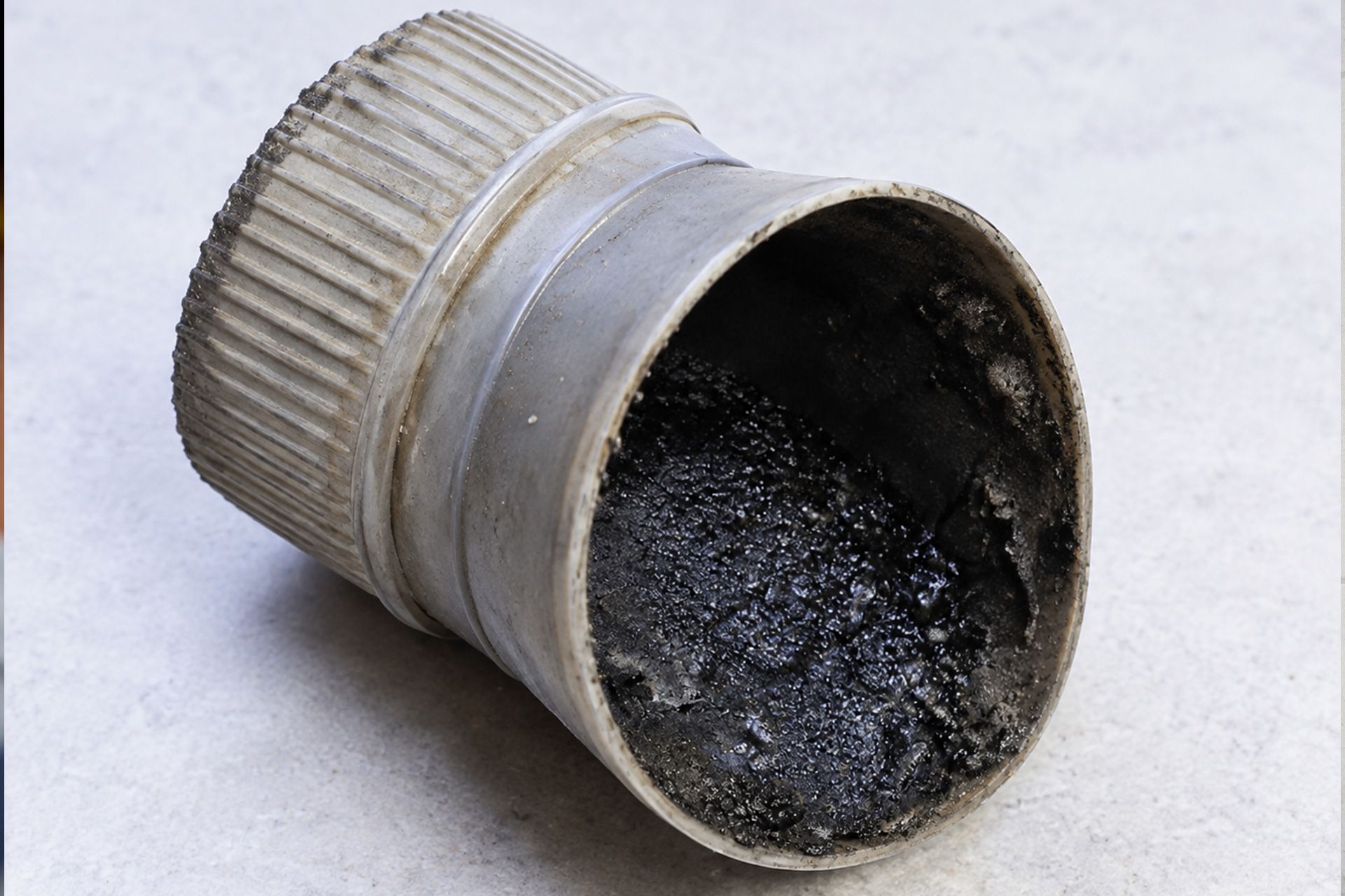 Creosote buildup in a Kentucky home chimney showing dark deposit along a wood-burning fireplace flue