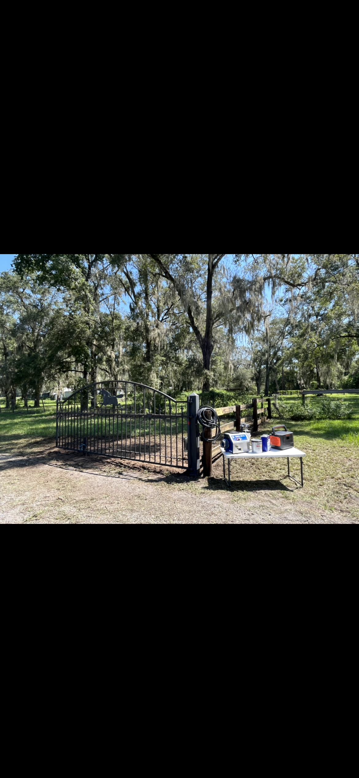 Park scene: monkey bars, table with items, trees in the background. Sunny, daytime.