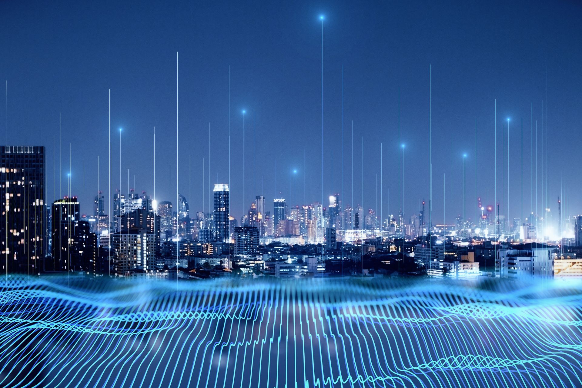 A city skyline at night with a lot of lines coming out of it.