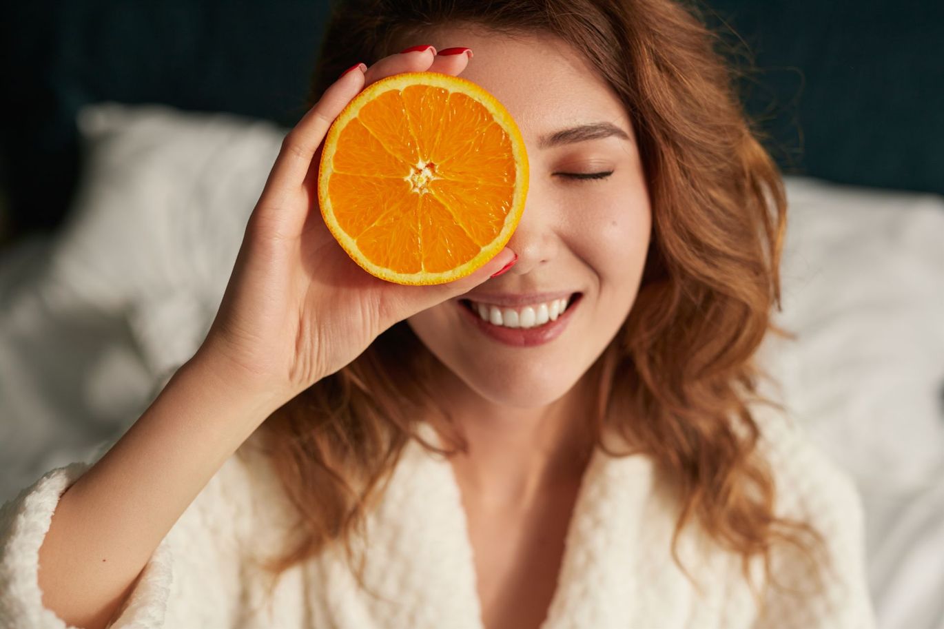 woman holding orange