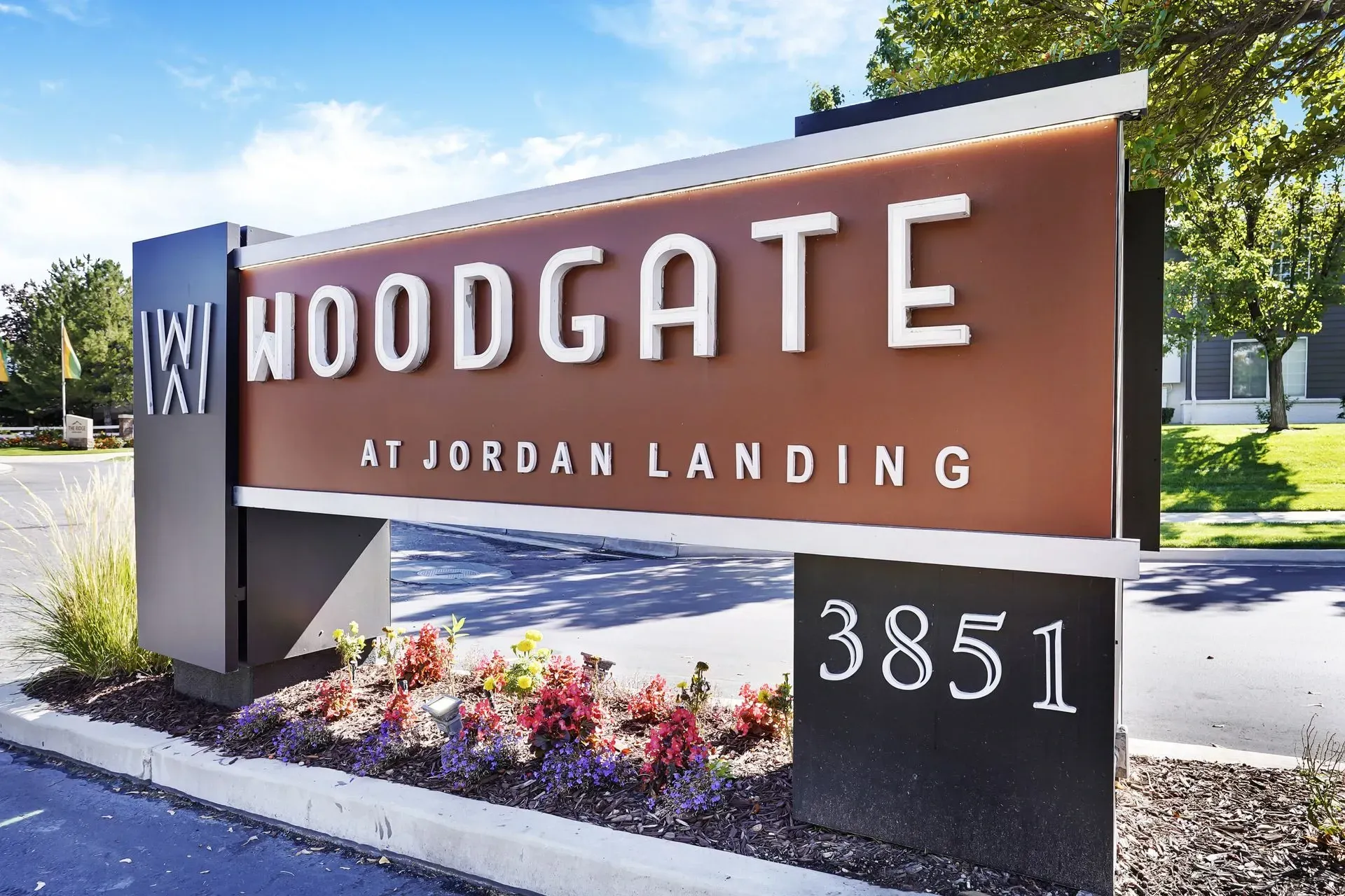 Woodgate at Jordan Landing monument sign with address 3851.