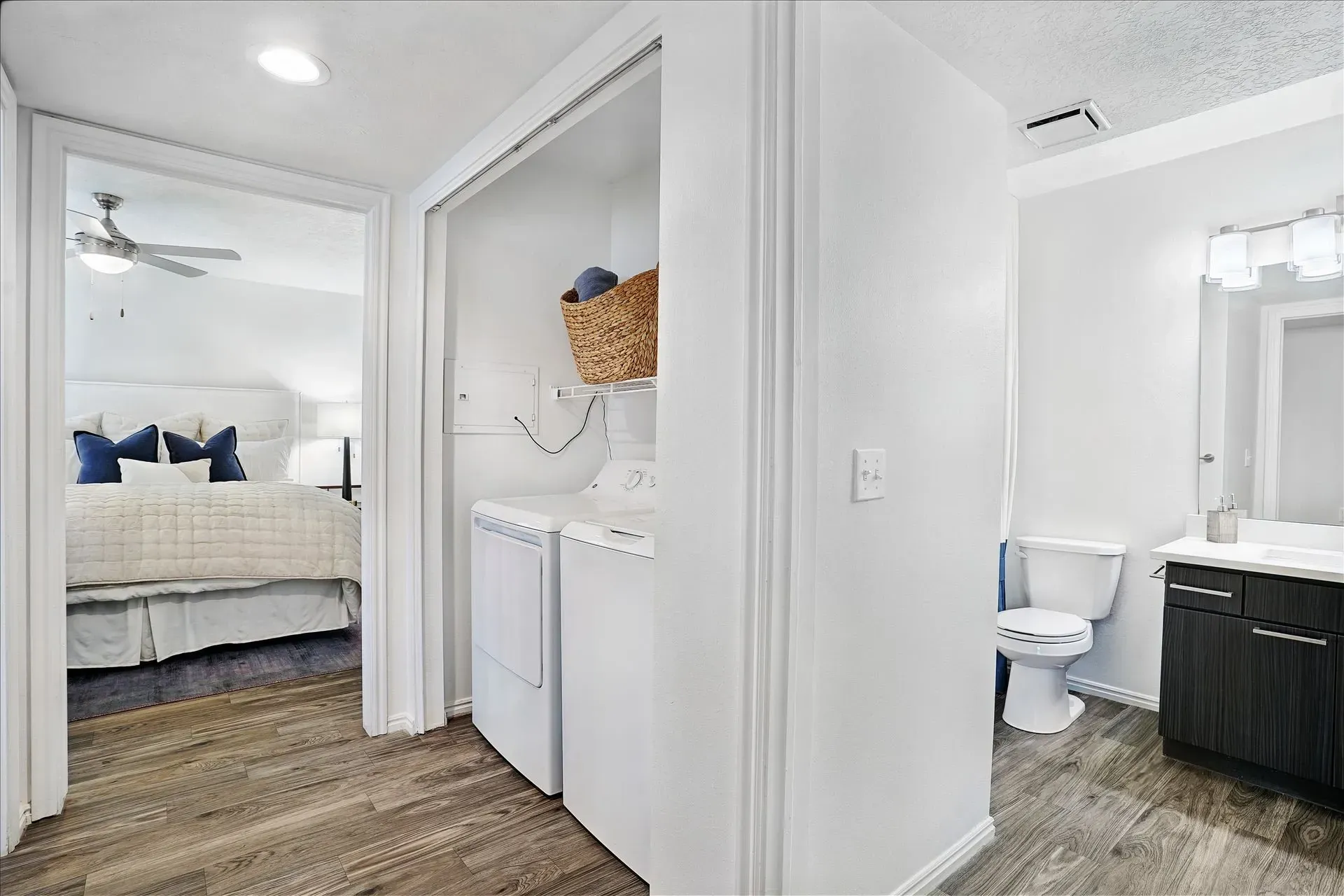 Laundry area and bathroom in a bedroom.