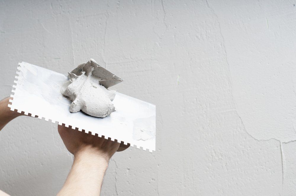 Man Preparing the Plaster — East Coast Cement Rendering in Byron Bay, NSW