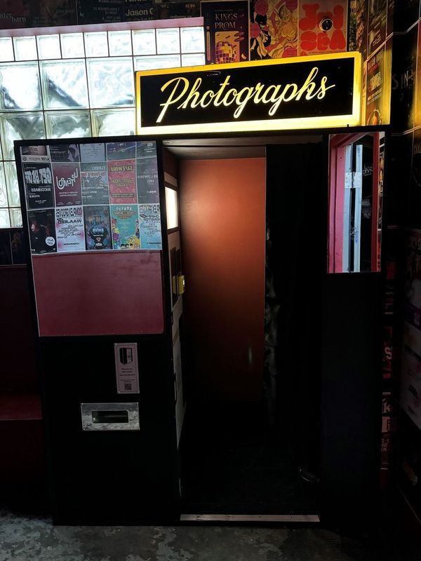 a dark room with a glow in the dark sign on the wall .