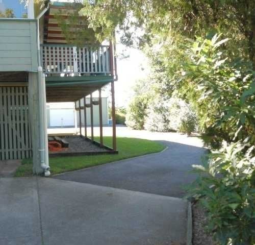 A House with A Porch and A Driveway — Roll Formed Driveways in Yandina, QLD