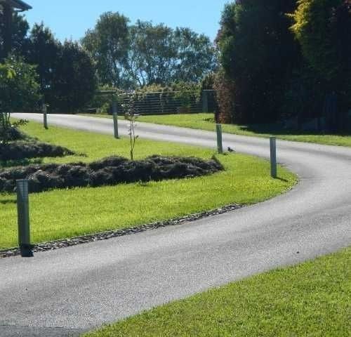 A Winding Road with Grass and Trees — Roll Formed Driveways in Yandina, QLD