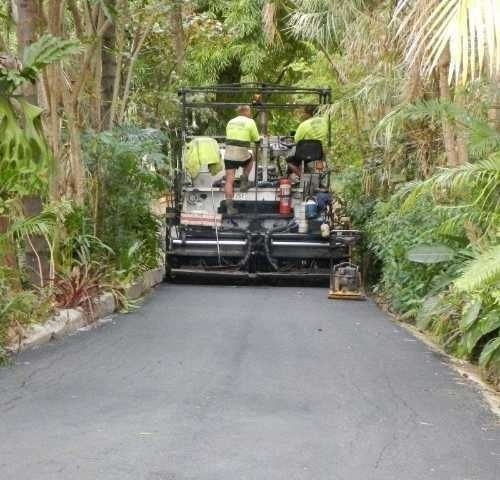 A Group of Men Working on A Road — Roll Formed Driveways in Yandina, QLD
