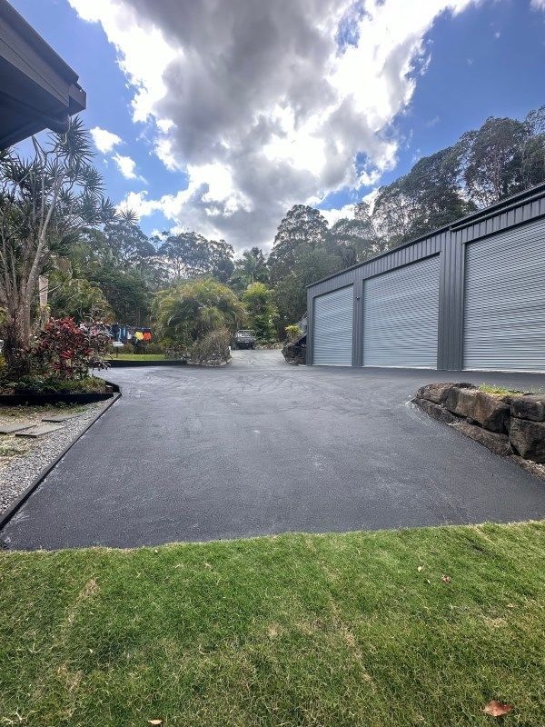 Modern Home And Curve Asphalt Driveway