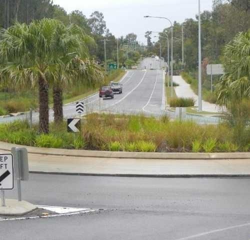 A Roundabout with A Sign that Says Keep Left — Roll Formed Driveways in Yandina, QLD