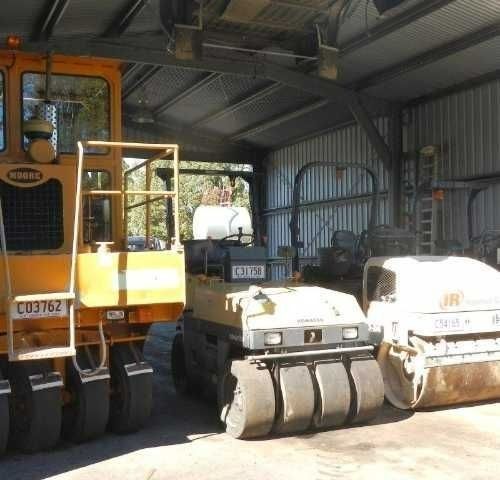 A couple of machines lined up next to each other — Roll Formed Driveways in Yandina, QLD