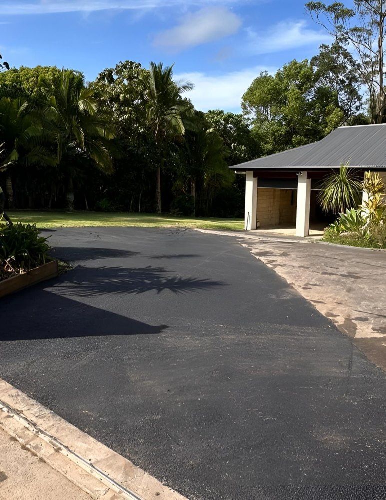 A newly constructed asphalt driveway.